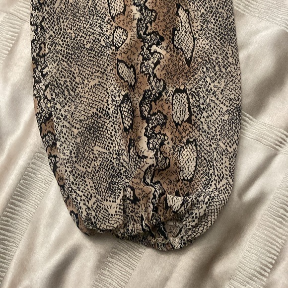 Puffy sleeves,ruffles 1/2 way down front opening. 100% polyester. - Picture 7 of 7